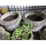 Pair of large cast concrete garden planters decorated in relief with swags and bows