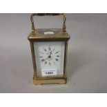 20th Century brass cased two train carriage clock, having enamel dial with Roman numerals, inscribed