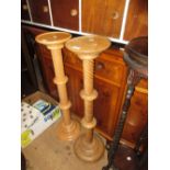 Near pair of 20th Century beechwood torcheres with spiral knopped columns and circular bases,