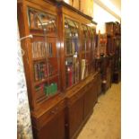 Large reproduction mahogany breakfront four door bookcase, the moulded top above four bar glazed