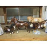 Group of four Beswick figures, a lion, an eagle and two horses, together with a Royal Doulton figure