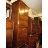 Small 20th Century mahogany tallboy with a moulded dentil cornice above two doors, brushing slide