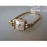 9ct Yellow gold ladies wristwatch, the dial enscribed Benrus We do not think the bracelet is gold (