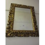 19th Century Florentine type carved and gilded rectangular wall mirror with bevelled plate, 35ins