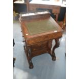 Victorian figured walnut and marquetry inlaid Davenport with a brass galleried top above four side