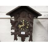 Swiss carved wooden two train weight driven cuckoo clock