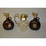 Cut glass and silver plate mounted claret jug together with a pair of glass liqueur decanters with
