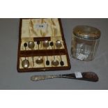 Case of six silver bean handled coffee spoons, silver handled shoe horn and a glass dressing table