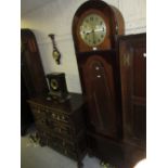 Early 20th Century mahogany longcase clock with an oval bevelled glass door, the circular silvered