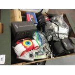 Box containing a quantity of various cameras and various mobile phones