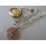 Gold plated floral engraved fob watch and a silver Albert chain
