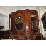 Victorian figured walnut chiffonier with a marble top above three mirrored doors on a plinth base