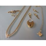 Two 9ct gold necklaces, 9ct gold bar brooch, 9ct gold padlock clasp and three 9ct gold 21st birthday