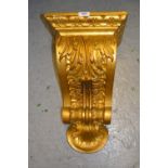 Set of four gilded composition corbels of neo classical design (one at fault) 11.5ins wide x 10ins