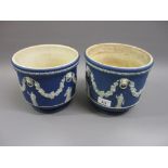 Pair of Wedgwood blue Jasperware jardinieres decorated with classical figures, lion masks and