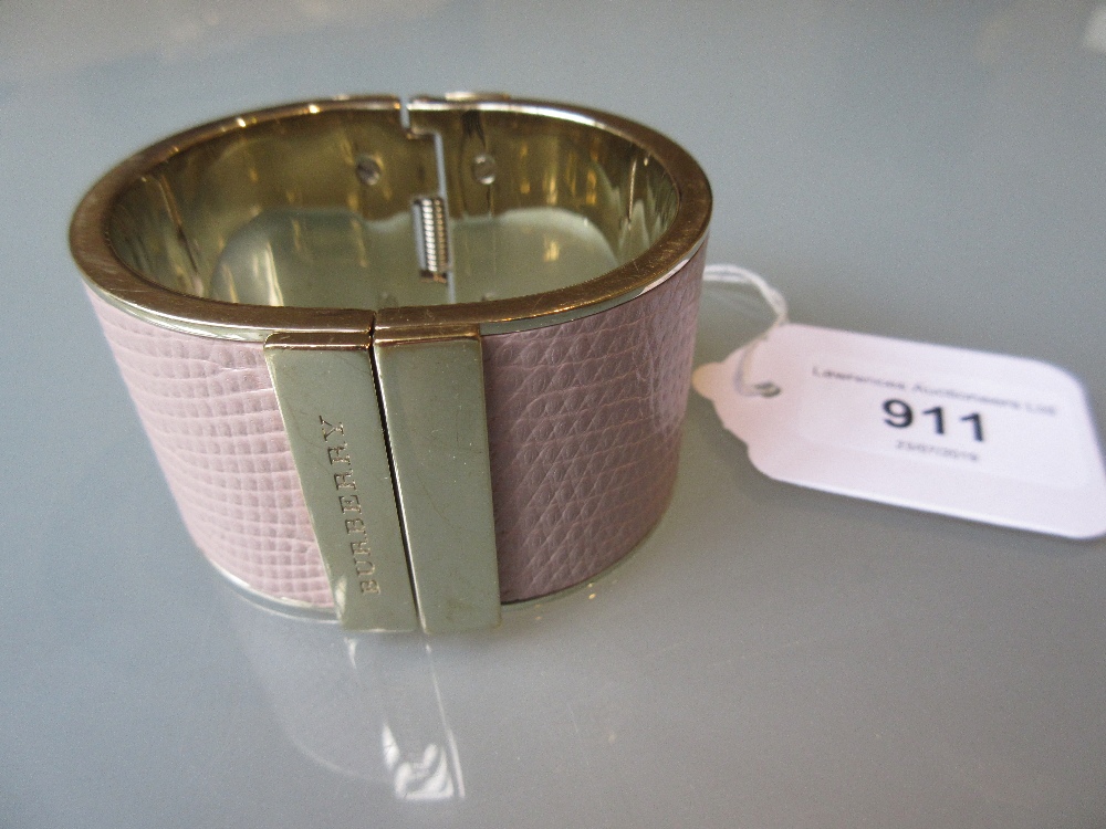 Burberry pink leather hinged cuff bracelet with gold tone brass surround