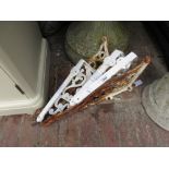 Set of four white painted cast metal wall brackets and another pair of cast iron white painted