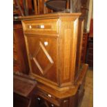 Pair of 20th Century oak side cabinets having single drawer and single panel door on bracket feet