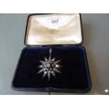 Victorian diamond set star form brooch of approximately 3ct total set old cut diamonds in original