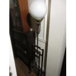 Chinese hardwood standard lamp with opaque glass ball form shade with carved and pierced Oriental