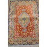 Indo Persian silk rug having central gol with all-over floral design on a wine ground with