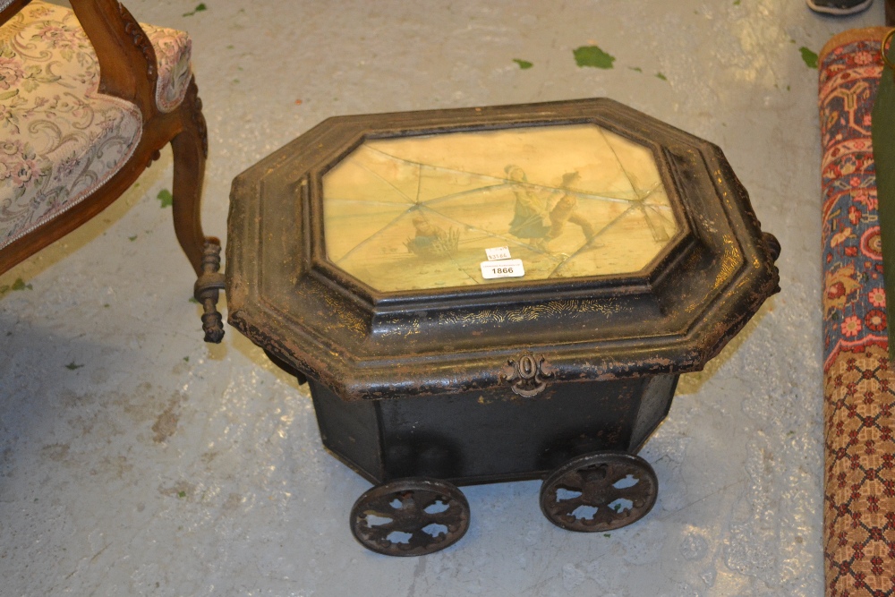 19th Century toleware octagonal shaped coalscuttle, the glass inset top housing a coloured print