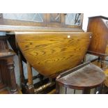 Reproduction oak dining room suite, comprising: an oval drop-leaf table, set of four ladder back