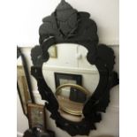 Large 20th Century Venetian style black glass framed wall mirror with engraved floral decoration and