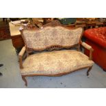 19th Century French carved walnut and floral upholstered two seater sofa on carved cabriole front