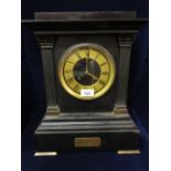 19th Century black slate and gilt metal mounted mantel clock, the rectangular case with flanking