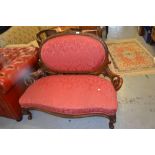 19th Century walnut two seat sofa having carved decoration and red upholstered back and seat