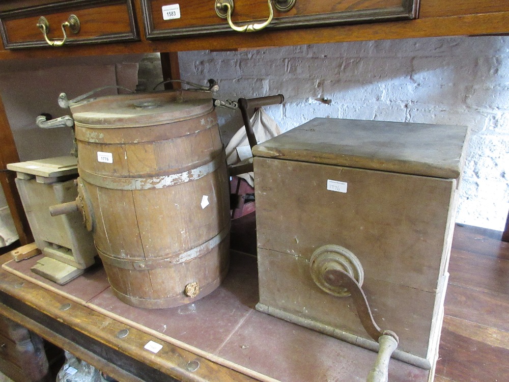 Three various 19th Century butter churns (at fault) together with a seed disperser and a grindstone