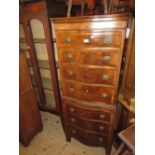 Small 20th Century walnut and crossbanded serpentine fronted tallboy of seven long drawers with