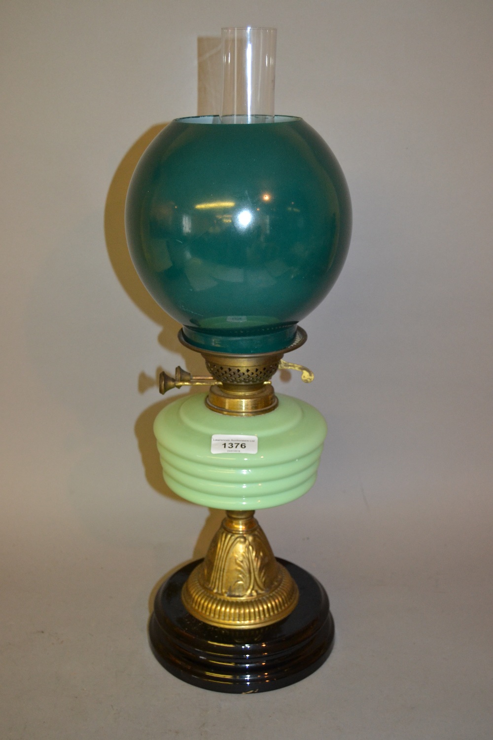 Victorian green opaque glass and brass oil lamp