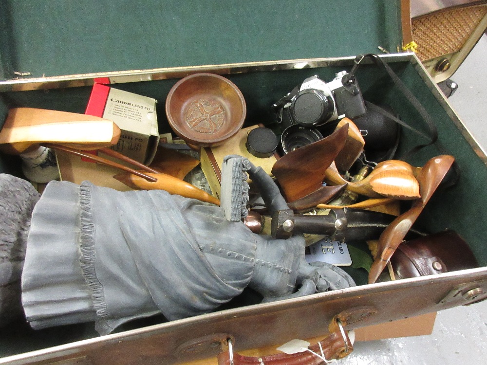 Brown suitcase containing a quanity of miscellaneous items including a resin figure of a lady