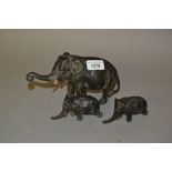 Group of three Japanese patinated spelter figures of elephants with character marks to underside,
