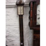 Reproduction mahogany and inlaid stick barometer together with a carved oak aneroid barometer