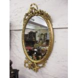 19th Century oval gilt moulded plaster girandole three branch wall mirror