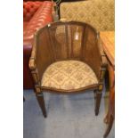 Pair of 19th Century French carved walnut and gilded tub shaped bergere chairs raised on fluted