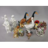Group of three Beswick figures of standing ducks (one at fault), Beswick figure of a penguin holding