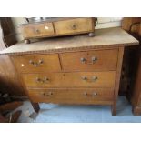 Arts and Crafts oak chest of two short and two long drawers on stile feet