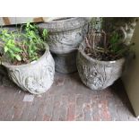Pair of weathered cast concrete garden planters, relief decorated with acanthus leaves