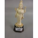 Indian carved ivory figure of the godess Kali standing on a Lotus blossom mounted on a horn base
