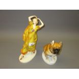 Czechoslovakian pottery figure of a girl dancer together with a Russian figure of a seated dog