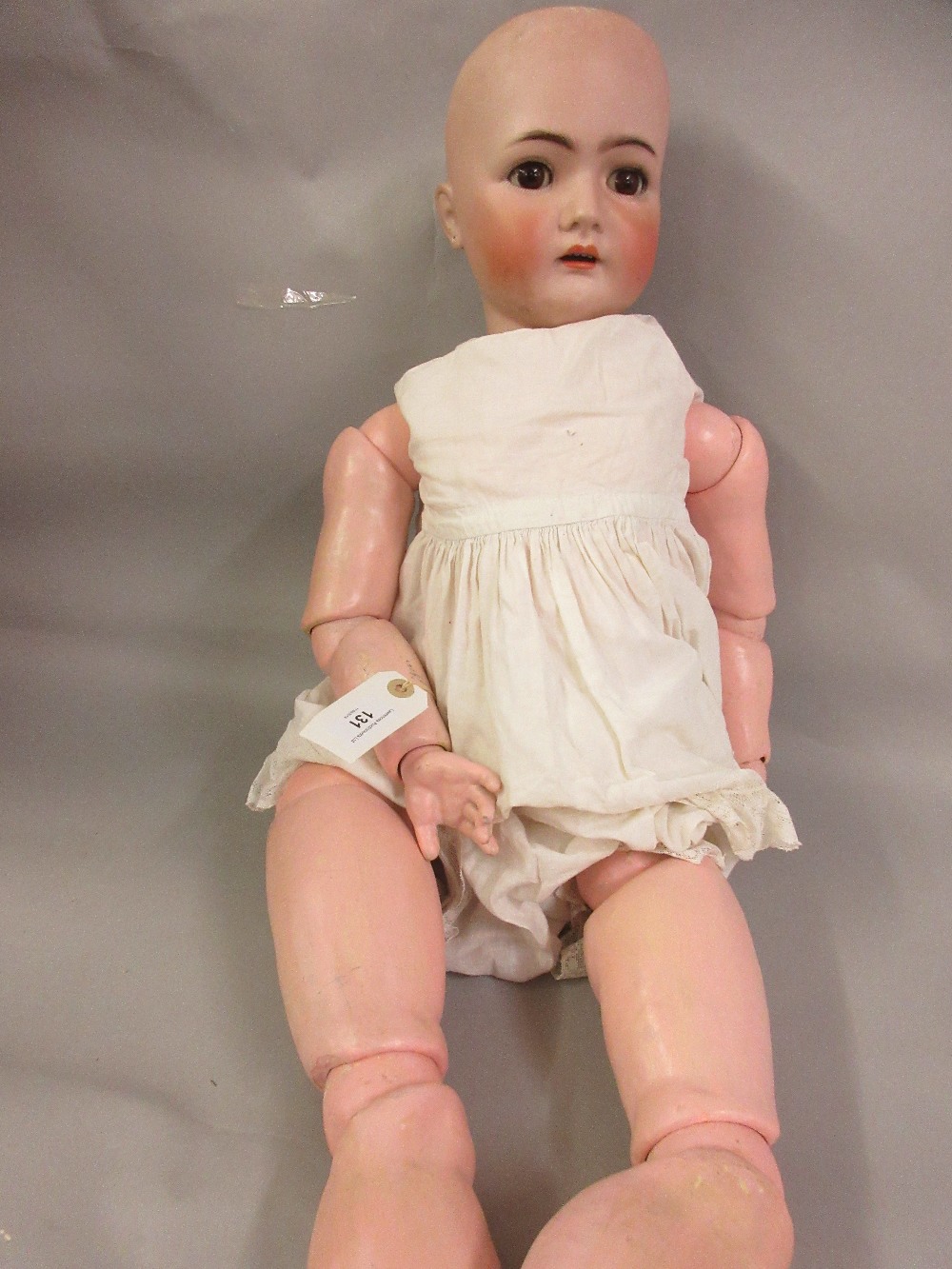 Large Simon Halbig bisque headed doll (body restored), 33ins high There is restoration to right hand