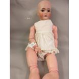 Large Simon Halbig bisque headed doll (body restored), 33ins high There is restoration to right hand
