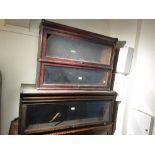 Two Globe Wernicke mahogany bookcase sections together with an oak bookcase section