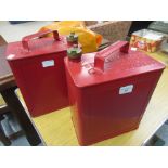 Two Valor red petrol cans with brass screw caps