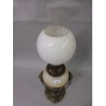 Late 19th/early 20th Century gilt metal and marble oil lamp the well mounted with lions head and