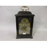 George III ebony and ebonised bracket or table clock, the dome case with brass carrying handle,